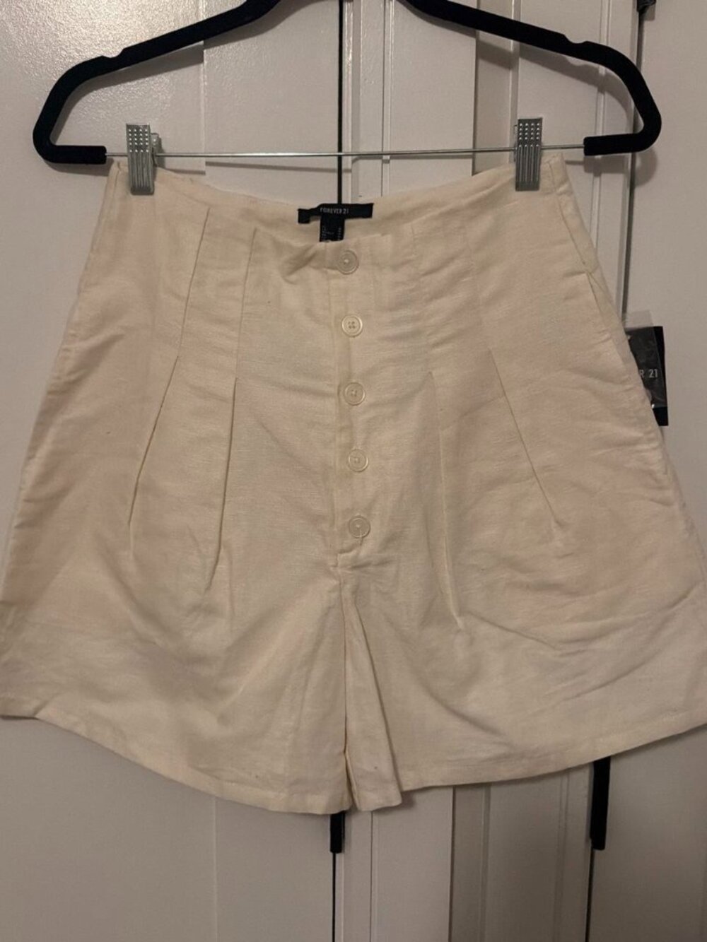 Cream linen shorts with button detail